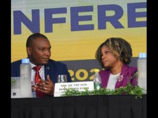 Dr Mark Smith, president of the Jamaica Teachers’ Association (JTA), in conversation with Education Minister Dr Dana Morris Dixon on day one of the JTA’s Education Conference at Ocean Coral Spring in Trelawny on Tuesday