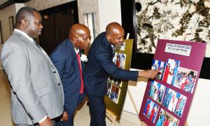 Photos from a previous year's presentation of the Jamaica Teachers' Association's stellar Award, The Roll of Honour, capture the interest of (from left): Mr. Norman Allen, Past President and current Regional Officer - West; Mr. Doran Dixon the 2024 honoree; and Mr. Clayton Hall, Past President and Deputy Secretary General responsible for Member Services and Industrial Relations.